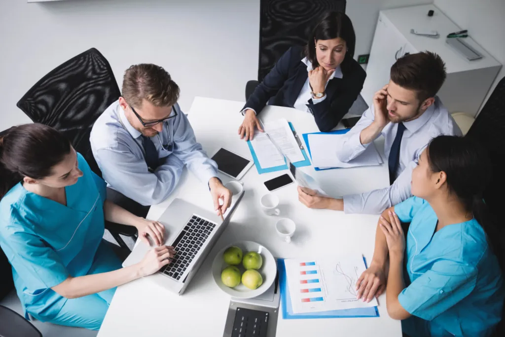 Medical Virtual Assistants a group of people sitting around a table